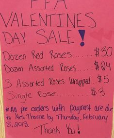 a valentine's day sale sign posted on a pink piece of paper with writing