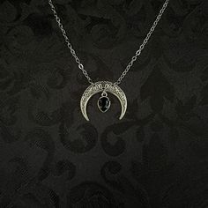 "This simple pendant features a richly detailed antiqued silver tone crescent, adorned with dazzling jet black glass crystals. Pendant is 1 1/8\" wide and 1\" tall.  Necklace length is adjustable with soldered stainless steel cable chain, lobster clasp and extender. If you would like a different length, please send us a message. Matching headpiece, pendant and earrings are listed separately in our store. If you don't see items with a color you want, feel free to ask about availability." Black Pewter Jewelry As A Gift, Gothic Oxidized Jewelry For Halloween, Black Mystical Jewelry For Halloween, Halloween Gothic Jewelry With Oxidized Finish, Mystical Black Metal Jewelry, Engraved Black Jewelry For Halloween, Gothic Black Engraved Jewelry, Black Moon Shaped Jewelry For Halloween, Black Engraved Jewelry For Halloween