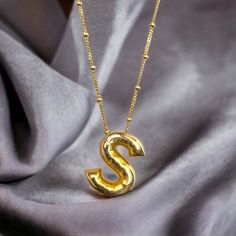 "Balloon Letter Necklace with Beaded Satellite Chain, 14k Gold Bubble Initial Pendant, Custom Puff Letter, Personalized Jewelry, Gift for Her ♛ Material: High Quality Solid 925 Sterling Silver ♛ Finish: Sterling Silver / Gold / Rose Gold Dimensions of the pendant: 17 x 17 mm All pieces will come with a 5\" extension chain so you can fine tune the fit. May you always have your signature necklace with you with the most unique and different jewelry you can find. All products are prepared with great care in our workshop with our masters. ◊ HOW TO MAINTAIN YOUR JEWELRY? ◊ * Separate your silver accessories in a tarnish-proof jewelry box. keep away from abrasive surfaces. (Comes in our Special Design Drawer Box) * To prevent fading, do not store your silver products in sunlight or, Do not keep i Gold Anniversary Letter Beads Necklace, Different Jewelry, Gold Bubbles, Silver Balloon, Silver Gift Wrap, Signature Necklace, Letter Balloons, Drawer Box, Silver Accessories