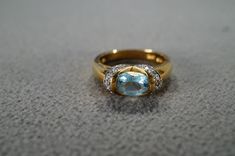 I am offering you this fabulous vintage sterling silver,with yellow gold overlay (stamped) wedding band stacker design ring. This piece is distinctive and stunning with the following features: It features 11 total combination prong and bezel set round and oval shaped genuine blue topaz and diamond stones. These stones are set in a raised relief multi stone design setting. What a fantastic Art Deco style ring we have here. It is currently a size 7, though it is could be sized up or down. It weigh Gold Oval Topaz Ring Stamped 14k, Fine Jewelry Oval Topaz Anniversary Ring, Oval Topaz Ring With Diamond Accents For Anniversary, Gold Hallmarked Topaz Wedding Ring, Formal Oval Topaz Ring Stamped 14k, Oval Topaz Ring Stamped 14k For Formal Occasions, Classic Gold Topaz Ring With Diamond Accents, Gold Oval Topaz Ring For Anniversary, Oval Gold Ring With Accent Stones For Wedding