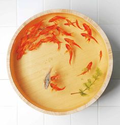 a bowl with goldfish painted on it