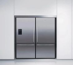 two stainless steel refrigerators side by side in a white room with light floors and walls