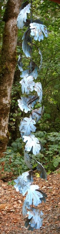 blue glass hanging from a tree in the woods