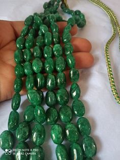 AAA 734 Carat Emerald beryl Oval Shape Fine Quality Smooth Beads With Adjustable Cord Necklace Stone : Emerald beryl Shape :- Oval Size :-6x8 - 12x17mm length - 18 inch, 3 line strings Weight :- 734 carat Polish :- Handmade color - green It is known as the 'love stone' as the message it emits is the strong vibration of unconditional love, joy, warmth and healing. As quartz crystals are profound amplifiers of energy, it may help to kindle happiness, love, romantic feelings and sensuality. It is g Oval Green Beaded Jewelry, Green Oval Beaded Jewelry, Elegant Gemstone Oval Beads, Green Oval Gemstone Beads Necklace, Oval Emerald Gemstone Beads Necklace Gift, Handmade Oval Green Beaded Necklace, Handmade Elegant Oval Gemstone Beads, Oval Beaded Necklace With Large Beads As Gift, Oval Beaded Necklace With Large Beads For Gifts