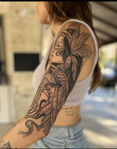 a woman with a tattoo on her arm