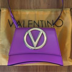 Pink/Purple Designer Handbag (Mariovalentino) % Authentic Brand New Never Worn Flawless Comes With Drawstring Sacpack For Protection And Certificate Of Authenticity Pink Evening Shoulder Bag With Logo, Luxury Purple Rectangular Bag, Luxury Purple Bag With Top Carry Handle, Luxury Purple Shoulder Bag, Luxury Purple Shoulder Bag With Top Handle, Luxury Purple Shoulder Bag With Top Carry Handle, Elegant Pink Shoulder Bag With Logo, Designer Purple Shoulder Bag With Detachable Handle, Luxury Purple Tote Bag