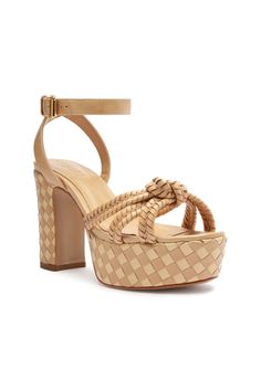 Elevate your summer style with the Kareena Woven Platform Sandal. Crafted from leather, this sandal boasts a unique woven design and a sturdy block heel for added stability. Perfect for any summer occasion, these sandals will elevate any outfit to new levels of sophistication and elegance.Materials: Leather Upper | Leather OutsoleHeel Type: High HeelHeel Style: Block HeelToe Style: Round ToeUpper Format: Multi-strapsClosure Type: Buckle UpCounter Type: OpenedHeel Height: 4,1 In | 105 mmSKU: S2034601520001 Beige Woven Leather Sandals, Beige Woven Leather Synthetic Sandals, Chic Sandals With Braided Straps In Natural Color, Chic Sandals With Braided Straps, Chic Natural Sandals With Braided Straps, Beige Closed Toe Woven Leather Sandals, Beige Closed Toe Sandals With Woven Leather, Beige Woven Ankle Strap Sandals, Beige Woven Leather Closed Toe Sandals