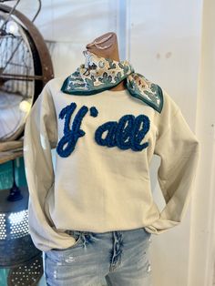 Get cozy in this Y'all cream sweatshirt with a teal puff graphic stitched on the front. Perfect for any western lover, this quirky and fun top adds a playful touch to any outfit. Yeehaw! 100% Cotton Womens Cozy Fall Outfits, Southern Chic Fashion, Western Embroidered Sweatshirt, Fall Concert Outfit Country, Cozy Mom Outfits, Trending Embroidery, Concert Outfit Fall, Cream Sweatshirt, Upcycle Clothes Diy