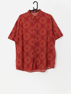 90s vintage red patterned shirt. This 1990s red shirt features a pastel brown and green abstract pattern, a button closure, short sleeves and is made from a mid-weight cotton blend.  Our recommended size: Large to XL Label says: XL Condition: Very good  Material: 70% cotton, 30% viscose Measurements in inches, laid flat: Pit to pit: 25 Shoulders: 19 Front length: 30 Back length: 30.5 Sleeve length: 10.5 We recommend that you compare our measurements to a similar item of your own to ensure good fit. Measurements are taken flat and doubled for waist and hip. Our items are vintage and may show signs of previous wear, etc. Any significant wear, damage or obvious marks will be photographed. Please inspect photos carefully. Our recommended sizes are based on UK sizes. https://www.instagram.com/s Red Retro Print Summer Tops, Red Retro Print Summer Shirt, Casual Red Shirt With Retro Print, Vintage Red Short Sleeve Camp Shirt, Retro Red Short Sleeve Camp Shirt, Red Floral Print Shirt With Relaxed Fit, Red Cotton Button-up Hawaiian Shirt, Retro Red Printed Camp Shirt, Red Cotton Hawaiian Button-up Shirt