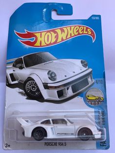 a white toy car is on display in a package for $ 3, 995