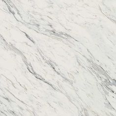 a white marble counter top with grey veiners