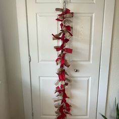 the door is decorated with red and white ribbons