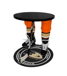 a hockey player standing on top of a table