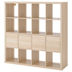 an open bookcase with six drawers and four doors on each side, in light wood