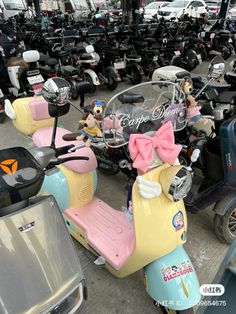 several scooters are parked in a parking lot with many other scooters