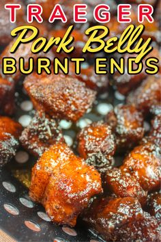 a close up of food on a plate with the title text overlay reads, traeger pork belly burnt ends