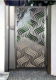 an open door with a decorative design on it's side and the doors are made out of metal