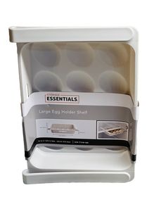 the large egg holder shelf is white and holds several trays with eggs in it