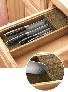 an open drawer with knives in it