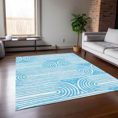 a blue and white rug in a living room