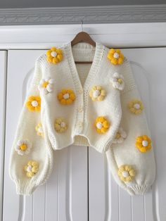 It is 100% handmade. You will be amazed by its unique stitching and knitting. It is a product you can use in all seasons. You can ask your questions about color and size in the message section. Knitted to order, color change and You can write your special orders in the message section. Products are prepared with love and care ❤️ A soft gift that will warm the hearts of your loved ones can be perfect 🎁 WASHING Do not put it in the washing machine or dryer, it requires hand washing. SHIPPING 🚚 S Cute Cropped Cardigan Outfits, Cute Cardagins, Cardigan Design Pattern, Handmade Cardigan Knitting, Crochet Cardigan With Flowers, Hand Knitted Sweaters For Women Handmade, Flower Cardigan Outfit, Yellow Winter Outfits, Flower Cardigan Crochet