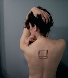 a woman with a tattoo on her back