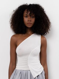 The Sakae Top features an asymmetric neckline, diagonal ruched detail, and asymmetric hem. Made from a soft, lightweight bamboo blend. White Assymetrical Top, Asymmetrical Top With Skirt, Asymmetric Hem Top, Asymmetric Tops For Women, Assymetrical Top Outfits, Interesting Necklines, Asymmetrical Top Outfit, Ss25 Runway, Ocean Alley