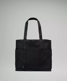 Daily Multi-Pocket Tote Bag 20L | Unisex Bags,Purses,Wallets | lululemon in Black Lululemon Bags, Picnic Essentials, Bag Stand, Essential Bag, Work Bags, Bags Purses, Black Tote Bag, Gifts For Mum, Womens Tote Bags