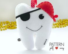 a tooth with a bandana on it is next to gold coins and the caption says pattern