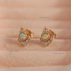 October Birthstone Earrings, Round Ethiopian Opal With Natural Diamond Dainty Stud Earrings, Push Back Earrings, Women Earrings, Gemstone Earrings. Great Gift For Mom, Sister, Friend, Girlfriend and Daughter. Also available in Rose Gold, White Gold and Yellow Gold. 𝐏𝐫𝐨𝐝𝐮𝐜𝐭 𝐢𝐧𝐟𝐨: 𝟏𝟒𝐤 𝐬𝐨𝐥𝐢𝐝 𝐠𝐨𝐥𝐝 ★𝐃𝐞𝐭𝐚𝐢𝐥𝐬 ★𝐒𝐊𝐔 𝐂𝐨𝐝 : 3006 ★𝐏𝐮𝐫𝐢𝐭𝐲 : Solid 14k Gold ( Also available in 9k & 18k Solid Gold) ★𝐌𝐞𝐭𝐚𝐥 : Yellow Gold ( Also available in Rose Gold & White Gold) ★𝐆𝐞𝐦𝐬𝐭𝐨𝐧𝐞 : 100 % Genuine Opal ( Also available in Other Gemstone) ★𝐒𝐭𝐨𝐧𝐞 𝐒𝐡𝐚𝐩𝐞 : Round ( Also available in Other Shape) ★𝐒𝐭𝐨𝐧𝐞 𝐒𝐢𝐳𝐞 : 3 MM ★𝐒𝐭𝐨𝐧𝐞 𝐰𝐞𝐢𝐠𝐡𝐭 : 0.16 Ct. Approx. ★𝐍𝐚𝐭𝐮𝐫𝐚𝐥, 𝐖𝐡𝐢𝐭𝐞 𝐃𝐢𝐚𝐦𝐨𝐧𝐝𝐬 ★𝐃𝐢𝐚𝐦𝐨𝐧𝐝𝐬 𝐂𝐥𝐚𝐫𝐢𝐭𝐲 : SI ★𝐃𝐢𝐚? Mini Studs, Tragus Earrings, Dainty Studs, Great Gifts For Mom, Birthstone Earring, Girls Earrings, Tragus, October Birth Stone, Minimalist Earrings