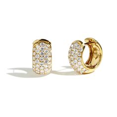 A beautiful pair of wide huggie earrings with 2.76ctw pav diamonds going down the front part of the hoop. These stylish earrings are crafted in 18K yellow gold. Luxury Huggie Earrings With Pave Setting In Cubic Zirconia, Luxury Huggie Hoop Earrings With Pave Setting, Luxury Diamond Huggie Earrings With Pave Setting, Luxury Pave Setting White Gold Huggie Earrings, Luxury White Gold Huggie Earrings With Pave Setting, Luxury Diamond Cut Huggie Earrings, Luxury Diamond Huggie Earrings With Single Cut Diamonds, Classic Diamond Huggie Earrings With Pave Setting, Diamond White Pave Huggie Earrings