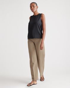 Quiet luxury meets everyday comfort in our Washable Stretch Silk Shell Tank. This whisper-light top is crafted from best-in-class mulberry silk with a hint of stretch for an ideal combination of softness and flexibility. Layered under a blazer or worn alone, its timeless design is elevated enough for special occasions yet stands up to daily wear. Best part? It's washable!  | Quince | Women's Washable Stretch Silk Shell Tank Top in Black, Size Large, Mulberry Silk Elegant Viscose Blouse For Layering, Modern Stretch Tank Top For Work, Silk Fitted Tops For Workwear, Fitted Silk Tops For Workwear, Elegant Silk Tops For Business Casual, Versatile Stretch Tops For Business Casual, Classic Viscose Tops For Work, Classic Formal Viscose Tops, Sleek Stretch Tops For Workwear