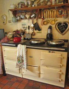 an old fashioned stove with pots and pans on it