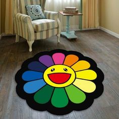 a living room with a flower rug on the floor and a chair in the background