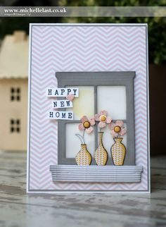 a card with flowers and vases on it, in front of a window that says home & garden essentials