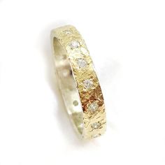 This is a breathtaking gentle ring made of sterling silver with a yellow gold strip soldered on top. The ring is set with (about) 20 cubic zirconia. (the amount of the gems depends on the size of the ring). The gold can be red or yellow. This will be a unique engagement ring or a beautiful gift for your loved ones. Measurements: Width: 0.14 inch / 3.5 mm. Thickness: 0.06 inch / 1.5 mm. 20 CZ are set in the ring, CZ diameter: 0.06 inch / 1.5 mm. This is a gorgeous ring and you can wear it with bo Sparkling Engagement Rings, Gorgeous Ring, Unique Engagement Ring, Cz Ring, Unique Engagement, Multi Stone Ring, Gold Set, Ring Sterling Silver, Unique Engagement Rings