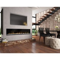 a living room with a large television mounted on the wall and a fire place in front of it