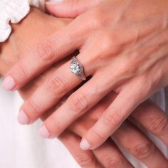 a close up of a person wearing a wedding ring