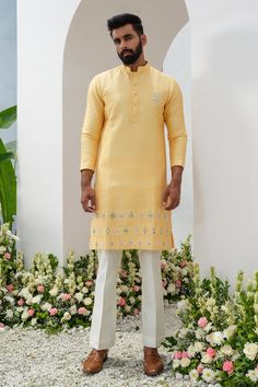 Yellow placed floral thread and cutdana embroidered kurta with mirrorwork. Comes with bell bottom pant.
Components: 2
Pattern: Embroidered
Type Of Work: Thread, Cutdana
Neckline: Mandarin Collar
Sleeve Type: Full
Fabric: Kurta: Raw Silk, Bellbottom: Cotton Silk
Color: Yellow
Other Details: 
Closure: Kurta: Front button
Occasion: Sangeet,Mehendi and Puja - Aza Fashions Anarkali Sherwani With Mirror Work For Diwali, Diwali Sharara With Floral Embroidery And Straight Kurta, Diwali Floral Embroidery Sharara With Straight Kurta, Floral Embroidered Palazzo Set With Straight Kurta For Diwali, Diwali Palazzo Set With Floral Embroidery And Straight Kurta, Embroidered Straight Kurta Palazzo Set For Diwali, Festive Embroidered Palazzo Set With Straight Kurta, Floral Embroidered Sharara With Straight Kurta For Festivals, Unstitched Resham Embroidered Kurta For Navratri