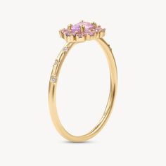 14k Yellow Gold Ring with Natural Sapphires and Diamonds. A delightful cluster of pink Sapphires, inspired by the seasonal beauty of Sakura or cherry blossom, all set on our signature band of Diamond stars. A bloom representing mortality, mindfulness and living in the present, Japanese cherry blossoms are a timeless metaphor for human existence. Blooming season is powerful, glorious and intoxicating, but tragically short-lived‚ this stunning piece reminder to enjoy the beauty within every given Delicate 14k Gold Pink Ring, Delicate Pink 14k Gold Rings, Delicate Pink Rings With Rose Cut Diamonds, Elegant Pink Cluster Ring In 14k Gold, Elegant Pink Cluster Ring With Rose Cut Diamonds, Elegant Pink 14k Gold Cluster Ring, Elegant Pink Rose Cut Diamond Cluster Ring, Pink Cluster Gemstone Ring, Pink Cluster Ring With Gemstone