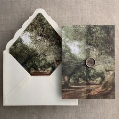 an open envelope with a card and photo inside