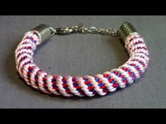 a red, white and blue bracelet with metal clasp