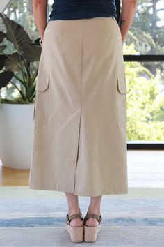 Semi-High Rise Midi Cargo Skirt 2 Front Pockets and 2 Side Cargo Pockets Hook, Zipper, and Bar Closure Back Slit Relaxed Slim Straight Fit 59% Cotton, 41% Lyocell Twill Machine Wash Cold, Line Dry Imported Our Model is 5'6" and is wearing a size 29 Midi Cargo Skirt, Cargo Skirt, Marble Colors, Clothing Items, Cool Outfits, High Rise, Marble, Bar, Zipper