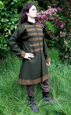 Viking coat for man is the basic outfit for a Scandinavian or Varangian warrior in the Early Middle Ages. It's made on the basis of finds from Birka - Swedish trade centre. It has two wedges on the sides and one on the back, making the circuit on the bottom bigger. Slightly tapered sleeves are sewn at right angles, with square underarm wedges, so they do not constrict movement. The coat has a machine stitching (invisible), and all visible stitching have been made manually. The coat is made of a Viking Coat, Medieval Shop, Viking Man, Scandinavian Clothing, Norse Clothing, Mens Garb, Viking Cosplay, Fantasy Garb, Viking Garb