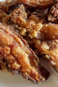 some fried food on a white plate ready to be eaten