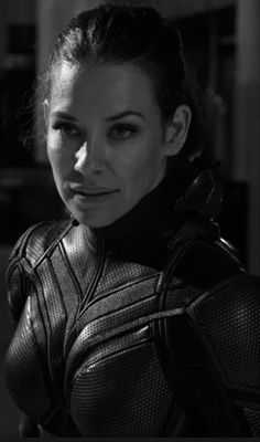 black and white photo of a woman in armor