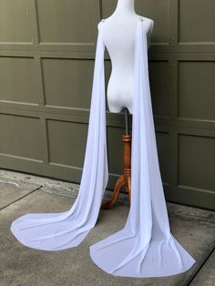 "Save yourself time and money by downloading your free \"Style Guide\" by copying and pasting this link: https://mailchi.mp/7293feff861f/veilguide Fanciful and fashion-forward, this flowy take on a wedding cape is ideal for brides who don't have a train on their dress or who want to make their train even longer! These are two separate detachable bridal wings that attach at the shoulders or at the back bodice of your dress (for strapless dresses) DETAILS * Soft flowy fabric that will be gentle an Wing Cape, Wedding Cape Veil, Elbow Length Veil, Cape Veil, Tulle Cape, Cape Pattern, Veil Styles, Short Veil, Wedding Veils Lace