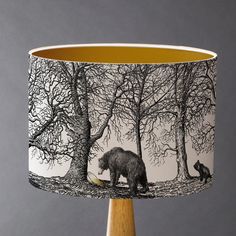 a lamp shade with an image of a bear and cub in the woods