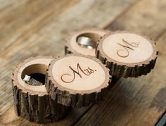 two wooden rings with the initials mr and mrs on them