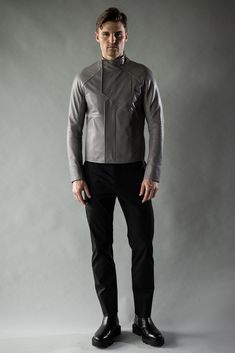 A leather jacket like a concrete slab. The District is inspired by the simple but refined beauty of Brutalist architecture. Clean, stark lines form the body panels and collar, while a hemispherical articulated raglan sleeve provides mobility in a close silhouette. Two front pockets are sealed with magnets, while two large zippered internal pockets offer larger, secure storage. A zippered chest pocket is accessible while the jacket remains zipped shut to provide accessible, discrete, and secure s Boris Bidjan Saberi, Leather Outerwear, Scarf Shirt, Brutalist Architecture, Concrete Slab, T Shirt Vest, New Instagram, Cow Leather, Raglan Sleeve